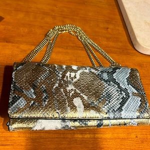 Metallic snake print , can be used as a hand bag,  over shoulder or crossbody.